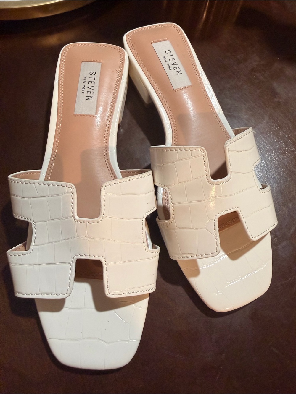 Seven Cream Croc-Embossed H-Detail Slide Mules in very good condition